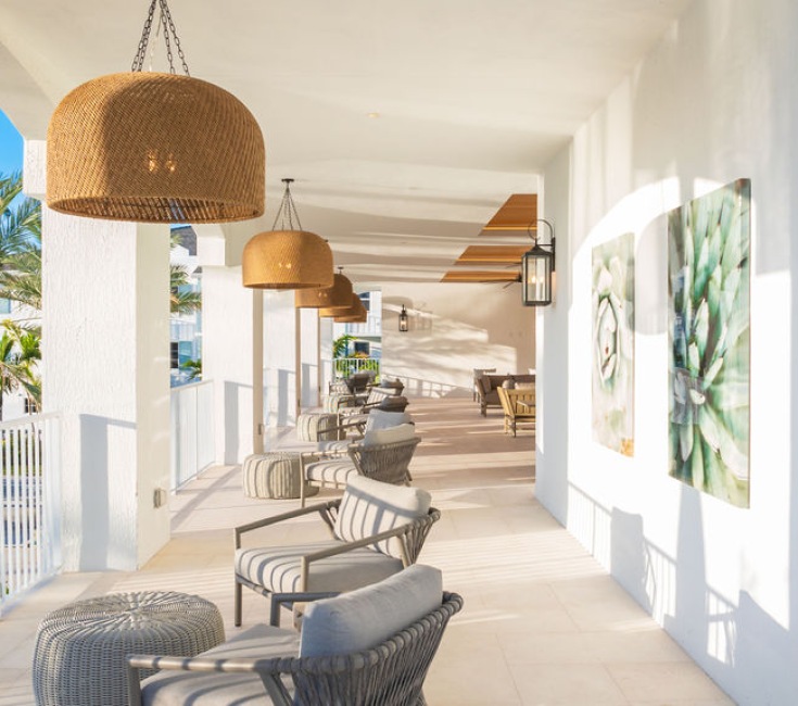veranda sunset seating wall art pendant lighting view palms